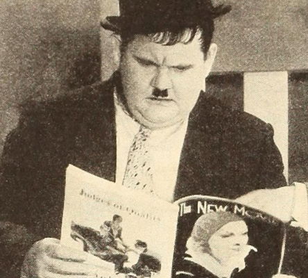 Photograph of actor Oliver Hardy reading an issue of 'The New Movie' magazine. He wears a jacket and bowler hat.||Hardy was a successful character actor in silent films and a partner in the Academy Award-winning comedy team of Laurel and Hardy. Born and raised in Georgia, Hardy performed in theater and vaudeville shows around the state early in his career, which laid the foundation for his later success as a film comedian.