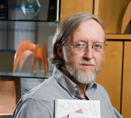 Stephen Corey holds three copies of the Georgia Review.